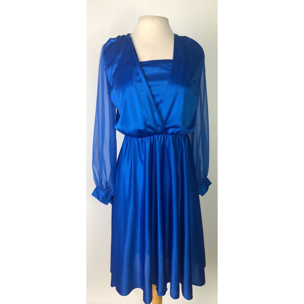 A vintage long sleeved dress with kick pleats